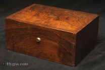 A very fine figured rosewood box with subtitle brass inlay  by D Edwards, with working Bramah lock.  The inside is compartmentalized  and lined in silk and leather. The box has two replacement lift out trays with velvet linings.  There are two additional little leather covered drawers at the bottom of the box. The wonderful green silk is original.  There is a silk and leather document wallet  with a lift out self standing mirror in the lid.  Edwards' boxes always have quality with amazing attention to detail. 