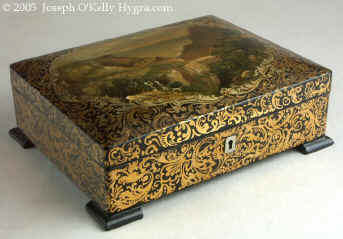 An artist painted Papier mâchè sewing box having its original fully fitted tray with Dieppe turned and carved spools and sewing tools Circa 1820.