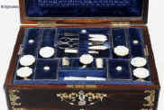 SB120: A fully fitted sewing box veneered in thick striated coromandel and inlaid in brass and shell, both mother of pearl and abalone. Inside there is the original fitted liftout tray lined with silk and velvet, with a set (6) of carved and turned mother of pearl daisy pattern spools designed for the new thread which now came on wooden reels. The tray also has supplementary lids with carved mother of pearl pulls. The box also has period sewing tools including penknife button hook, and tweezers, and bodkin with mother of pearl handles. The steel scissors is designed for cutting button holes. There is a document wallet in the lid. Circa 1870. Enlarge Picture